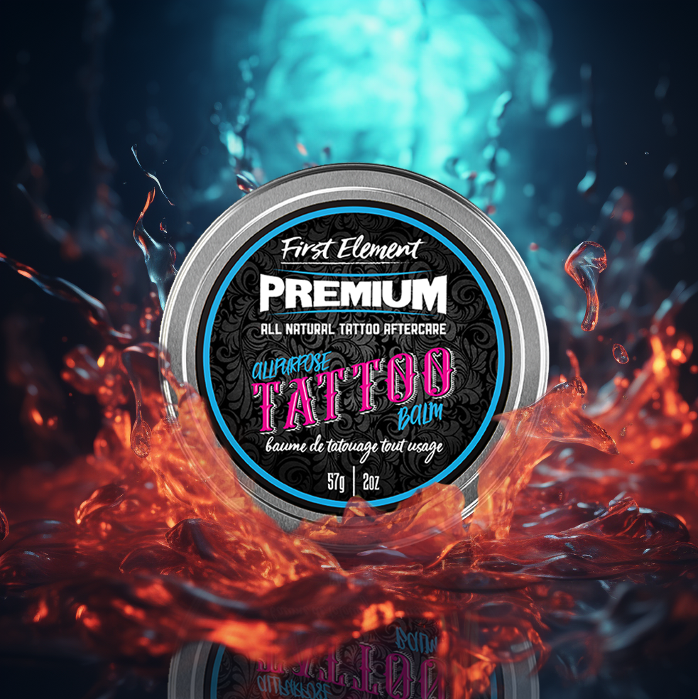 A 2oz tin of revitalizing all-purpose tattoo balm, displayed on a water splash background.